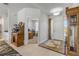 Entryway with tile flooring leading to an office and showcasing a wooden clock and bar at 1929 Pioneer Trl, New Smyrna Beach, FL 32168