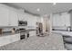 Bright kitchen featuring granite countertops and stainless steel appliances at 1929 Pioneer Trl, New Smyrna Beach, FL 32168