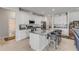Kitchen featuring granite countertops, a large island, and stainless steel appliances at 1929 Pioneer Trl, New Smyrna Beach, FL 32168