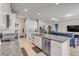 Open floor plan showing kitchen with stainless appliances and cozy living area at 1929 Pioneer Trl, New Smyrna Beach, FL 32168
