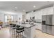 Kitchen with granite countertops, a large island, and stainless steel appliances at 1929 Pioneer Trl, New Smyrna Beach, FL 32168