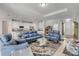 Open-concept living room showing kitchen, seating area, and lots of natural light at 1929 Pioneer Trl, New Smyrna Beach, FL 32168
