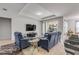 Bright and airy living room with an open floor plan, tile flooring, and patio access at 1929 Pioneer Trl, New Smyrna Beach, FL 32168