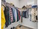 Walk-in closet with shelving and hanging racks provides ample storage space for clothing and accessories at 1929 Pioneer Trl, New Smyrna Beach, FL 32168