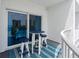 Relaxing outdoor balcony featuring a table and chairs, perfect for enjoying the ocean views at 2 Oceans West Blvd # 608, Daytona Beach Shores, FL 32118