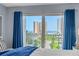 Bright balcony view highlighting a neighborhood with views of the ocean and surrounding buildings at 2 Oceans West Blvd # 608, Daytona Beach Shores, FL 32118