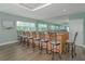 Common area featuring a bar with seating and a large mirror reflecting natural light at 2 Oceans West Blvd # 608, Daytona Beach Shores, FL 32118