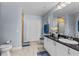 Bright bathroom featuring tile floors, modern vanity with a framed mirror and updated lighting at 2 Oceans West Blvd # 608, Daytona Beach Shores, FL 32118