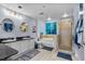 This bathroom features a walk-in shower, bath tub, double vanity, and modern fixtures at 2 Oceans West Blvd # 608, Daytona Beach Shores, FL 32118