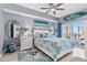 This bedroom features soft lighting, nautical themed decor, and balcony access at 2 Oceans West Blvd # 608, Daytona Beach Shores, FL 32118