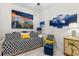 Guest bedroom featuring a daybed, artwork, and comfortable seating at 2 Oceans West Blvd # 608, Daytona Beach Shores, FL 32118