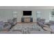 Comfortable resident room featuring soft armchairs, a tv, and neutral decor at 2 Oceans West Blvd # 608, Daytona Beach Shores, FL 32118
