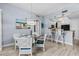 Dining area with direct access to kitchen and seating for four at 2 Oceans West Blvd # 608, Daytona Beach Shores, FL 32118