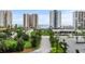Exterior view of condo buildings with well manicured landscaping and green space at 2 Oceans West Blvd # 608, Daytona Beach Shores, FL 32118