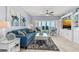 Cozy living room with plush seating, a water view, and coastal-themed accents at 2 Oceans West Blvd # 608, Daytona Beach Shores, FL 32118