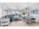 Living room featuring water view, comfortable seating, and stylish coastal decor at 2 Oceans West Blvd # 608, Daytona Beach Shores, FL 32118