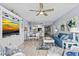 Open-concept living room and kitchen featuring modern appliances and stylish decor at 2 Oceans West Blvd # 608, Daytona Beach Shores, FL 32118