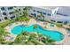 Resort-style pool area with palm trees, lounge chairs, and a hot tub for relaxation at 2 Oceans West Blvd # 608, Daytona Beach Shores, FL 32118