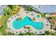 Inviting pool and hot tub area surrounded by lounging furniture and lush landscaping at 2 Oceans West Blvd # 608, Daytona Beach Shores, FL 32118