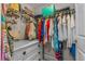 Well-organized walk-in closet provides ample storage with custom shelving and drawers at 2 Oceans West Blvd # 608, Daytona Beach Shores, FL 32118