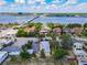 Beautiful aerial view of colorful houses near a waterfront with a bridge and tropical foliage at 20 N Halifax Ave, Daytona Beach, FL 32118