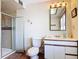 Bathroom includes a shower, toilet, vanity, and decorative mirror at 20 N Halifax Ave, Daytona Beach, FL 32118