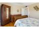 Bedroom showcasing wood floors and a full-sized bed with plenty of storage at 20 N Halifax Ave, Daytona Beach, FL 32118