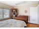 Traditional bedroom featuring hardwood floors, neutral wall colors, and a large dresser at 20 N Halifax Ave, Daytona Beach, FL 32118