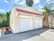Detached garage with a red tiled roof at 20 N Halifax Ave, Daytona Beach, FL 32118