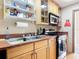 Well-lit kitchen featuring wooden cabinets, stainless steel appliances, and practical design at 20 N Halifax Ave, Daytona Beach, FL 32118