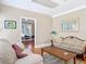 Living room featuring hardwood floors, a doorway to another room, and seating at 20 N Halifax Ave, Daytona Beach, FL 32118