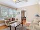 Living room featuring hardwood floors, large windows, and furniture at 20 N Halifax Ave, Daytona Beach, FL 32118