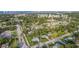 An aerial view of a neighborhood showcasing a beautiful home surrounded by lush greenery and other houses at 2009 Brian Ave, South Daytona, FL 32119