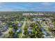 Aerial view shows location of property in a residential neighborhood surrounded by trees at 2009 Brian Ave, South Daytona, FL 32119