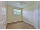 Bedroom featuring wood-look flooring, ceiling fan, window, and closet at 2009 Brian Ave, South Daytona, FL 32119