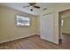 Bedroom with wood-look floors, ceiling fan, window, and a closet at 2009 Brian Ave, South Daytona, FL 32119