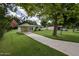 Charming one-story home with a well-manicured lawn and mature trees at 2009 Brian Ave, South Daytona, FL 32119