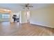 Open-concept living area with new flooring, seamlessly connected to the kitchen with stainless steel appliances at 2009 Brian Ave, South Daytona, FL 32119