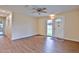 Inviting living room featuring new flooring, a ceiling fan, and ample natural light at 2009 Brian Ave, South Daytona, FL 32119