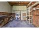 View of interior of shed with plywood walls, shelving, and workbench at 2009 Brian Ave, South Daytona, FL 32119