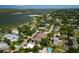 Aerial view of a beautiful home with water access to Menard-May Park, highlighting the neighborhood at 206 S Riverside Dr, Edgewater, FL 32132