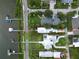 Property highlighted in an aerial view showing its location, boat dock, and proximity to the surrounding neighborhood at 206 S Riverside Dr, Edgewater, FL 32132