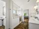 Bright bathroom featuring a glass-enclosed shower and white vanity at 206 S Riverside Dr, Edgewater, FL 32132