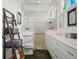 Bathroom with glass shower, white cabinets, and tile flooring at 206 S Riverside Dr, Edgewater, FL 32132