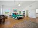 Spacious bedroom featuring hardwood floors, a ceiling fan, and bright natural light at 206 S Riverside Dr, Edgewater, FL 32132