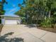 Large driveway leading to a spacious two-car garage and well-maintained front yard at 206 S Riverside Dr, Edgewater, FL 32132