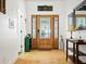 Stunning entryway with a decorative glass front door and wood floors at 206 S Riverside Dr, Edgewater, FL 32132