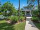 Charming two-story home with a welcoming front porch and lush landscaping at 206 S Riverside Dr, Edgewater, FL 32132