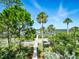 This well-manicured front yard provides a serene walkway to the home and lovely water views at 206 S Riverside Dr, Edgewater, FL 32132