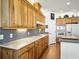 Bright kitchen with wooden cabinets, quartz countertops, and stainless gas range at 206 S Riverside Dr, Edgewater, FL 32132